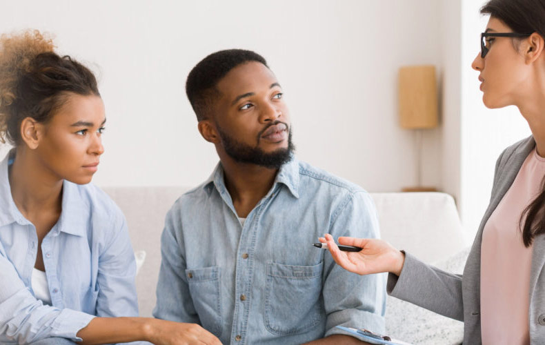 psychologist advising african american spouses